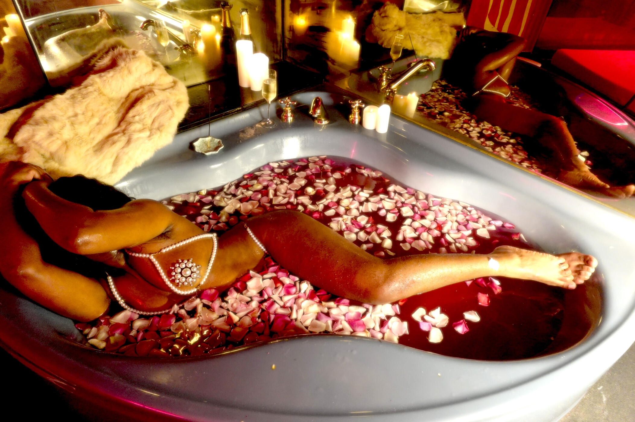 Untitled Black woman bathes in a tub